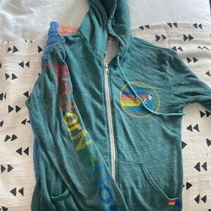 Av nation
Green Zip-Up Hoodie with Rainbow Logo